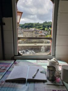 Writing in journal Carriage Tea Room