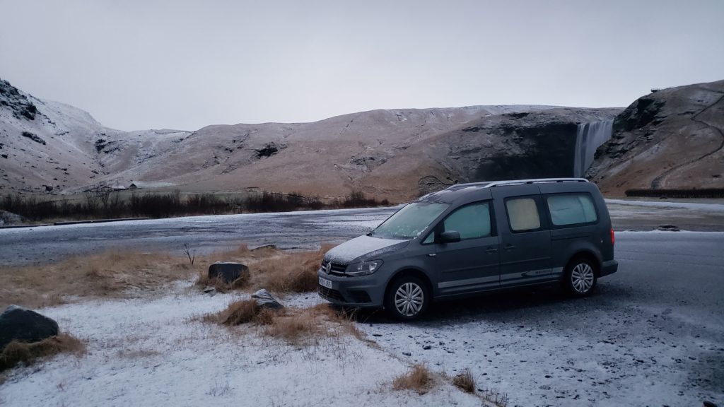 Van at Iceland campsite with snow